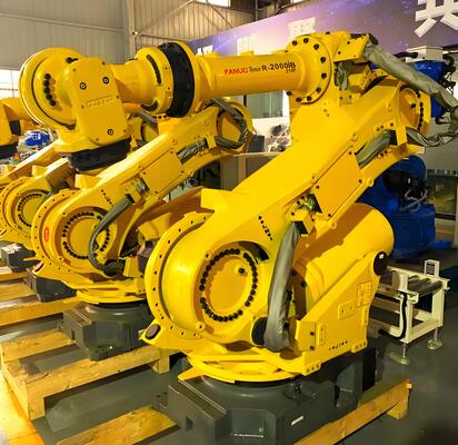 Sel pemotong laser FANUC dengan loading / unloading otomatis dan meja putar untuk produksi massal benda kerja logam 3D di industri otomotif