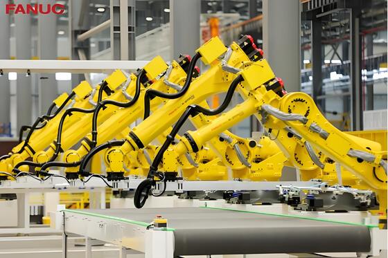 Sel pemotong laser FANUC dengan loading / unloading otomatis dan meja putar untuk produksi massal benda kerja logam 3D di industri otomotif