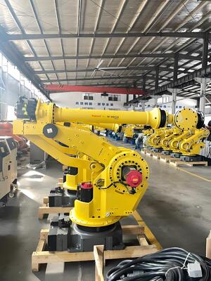 Sel pemotong laser FANUC dengan loading / unloading otomatis dan meja putar untuk produksi massal benda kerja logam 3D di industri otomotif
